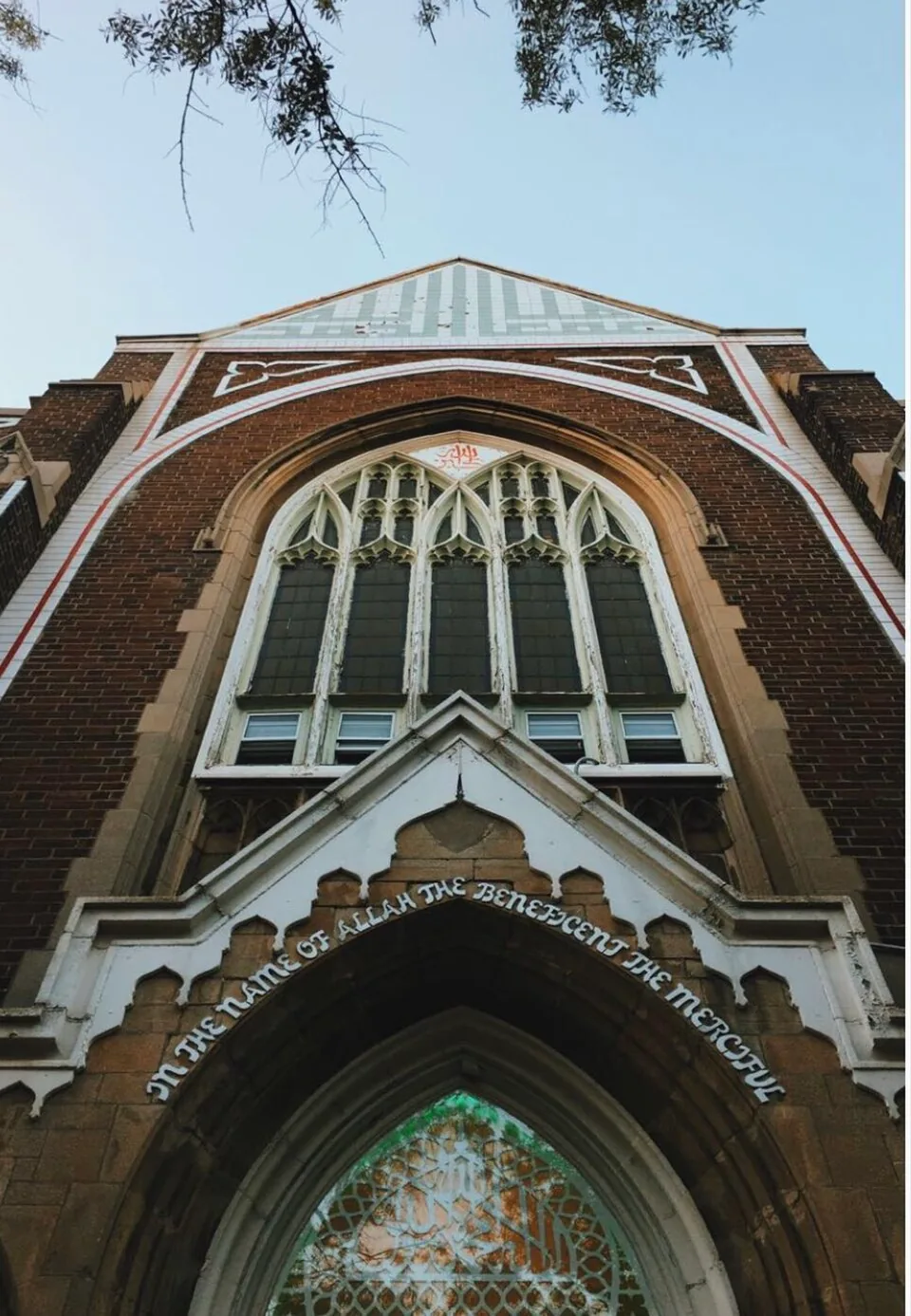 Brick mosque exterior with pointed arched windows